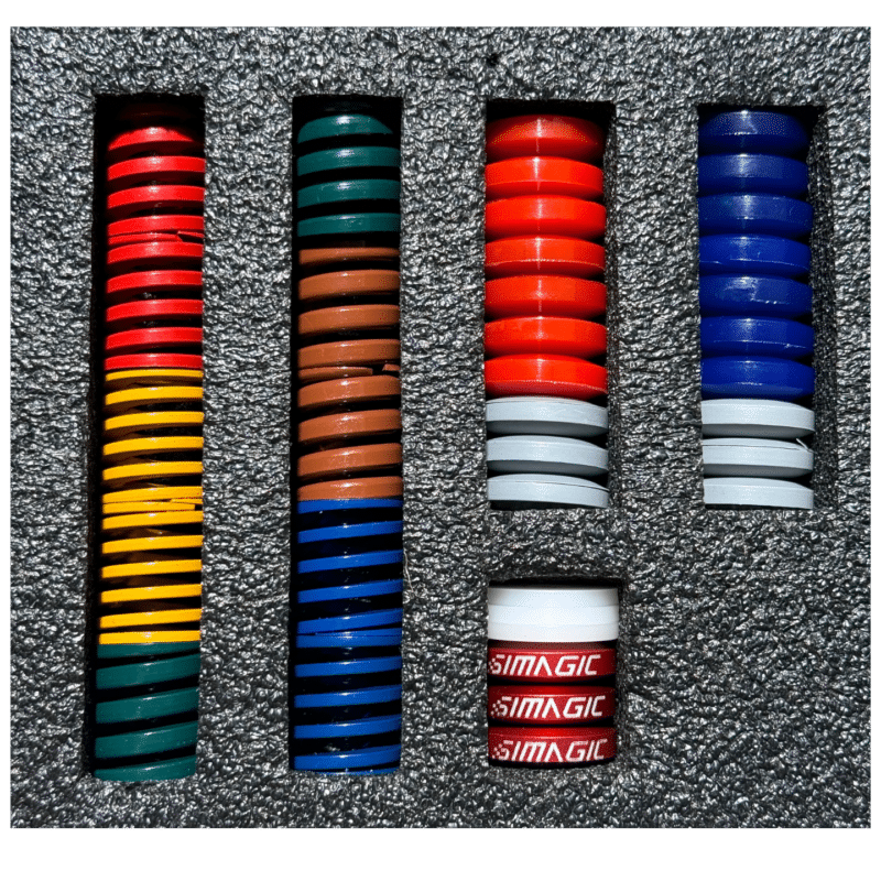 Simagic P1000 brake upgrade kit arranged inside foam insert showing full kit components and organized layout