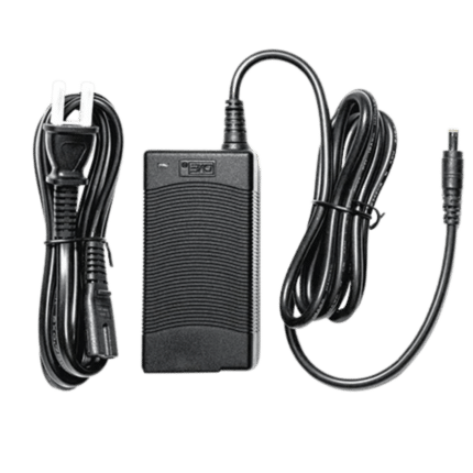 Simagic power supply unit with AC cable and DC connector showing complete adapter setup for sim racing hardware