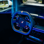Simagic Neo X-310G wheel installed on sim racing cockpit with monitor and AOC display, designed for GT-style racing.